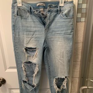 Light wash distressed jeans.